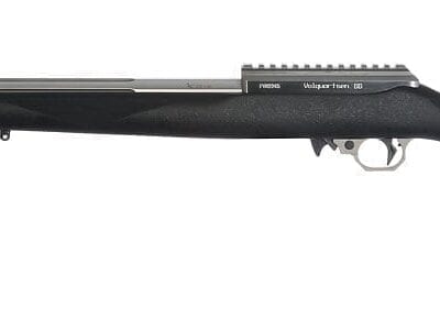 A black deluxe rifle firearm pointing to the left